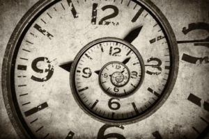 Close up of a clock face coiling in a spiral